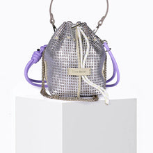 Silver drawstring bag with purple straps on a white background