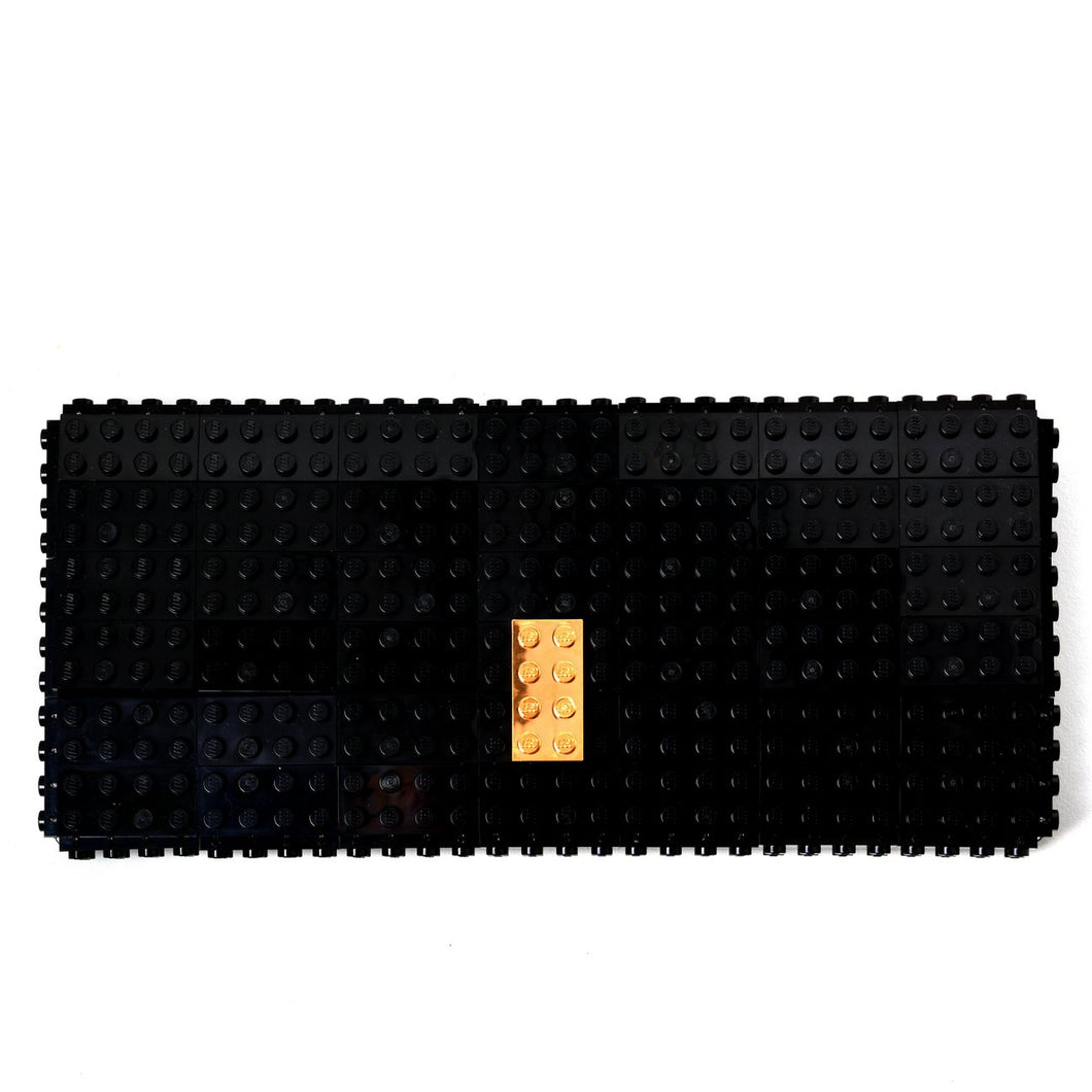 Black Lego clutch with gold plated brick