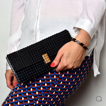 Black Lego clutch with gold plated brick